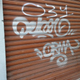Graffiti on a shuttered store in Milan near the Galleria shopping center.